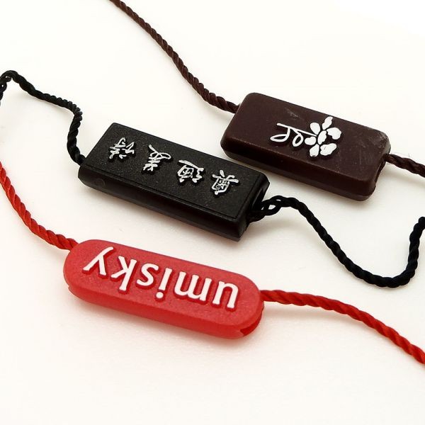 廠家直銷新款通用服裝吊粒吊繩 塑料商標吊?？擅赓Mlogo設計